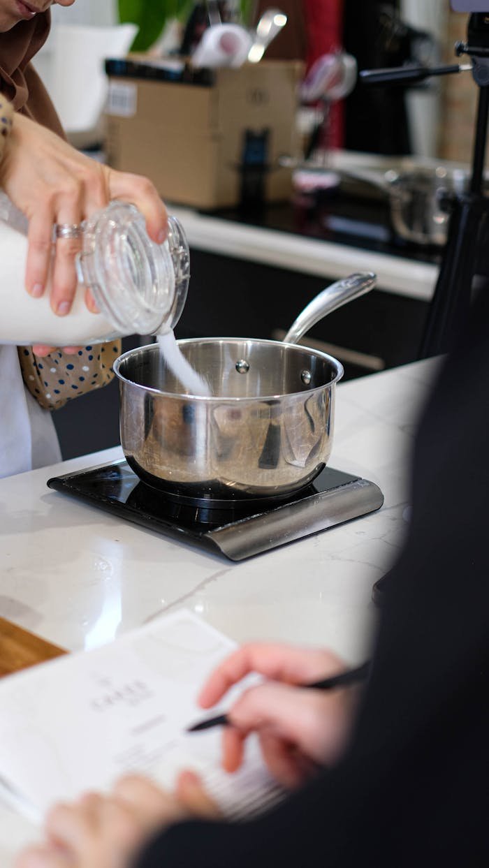 Participants engaging in a hands-on cooking class making culinary dishes.